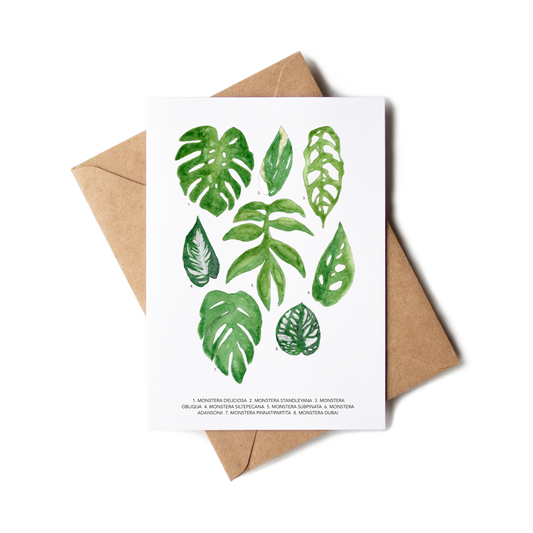 Greeting card with green leaf illustrations on a white background, accompanied by a brown envelope.