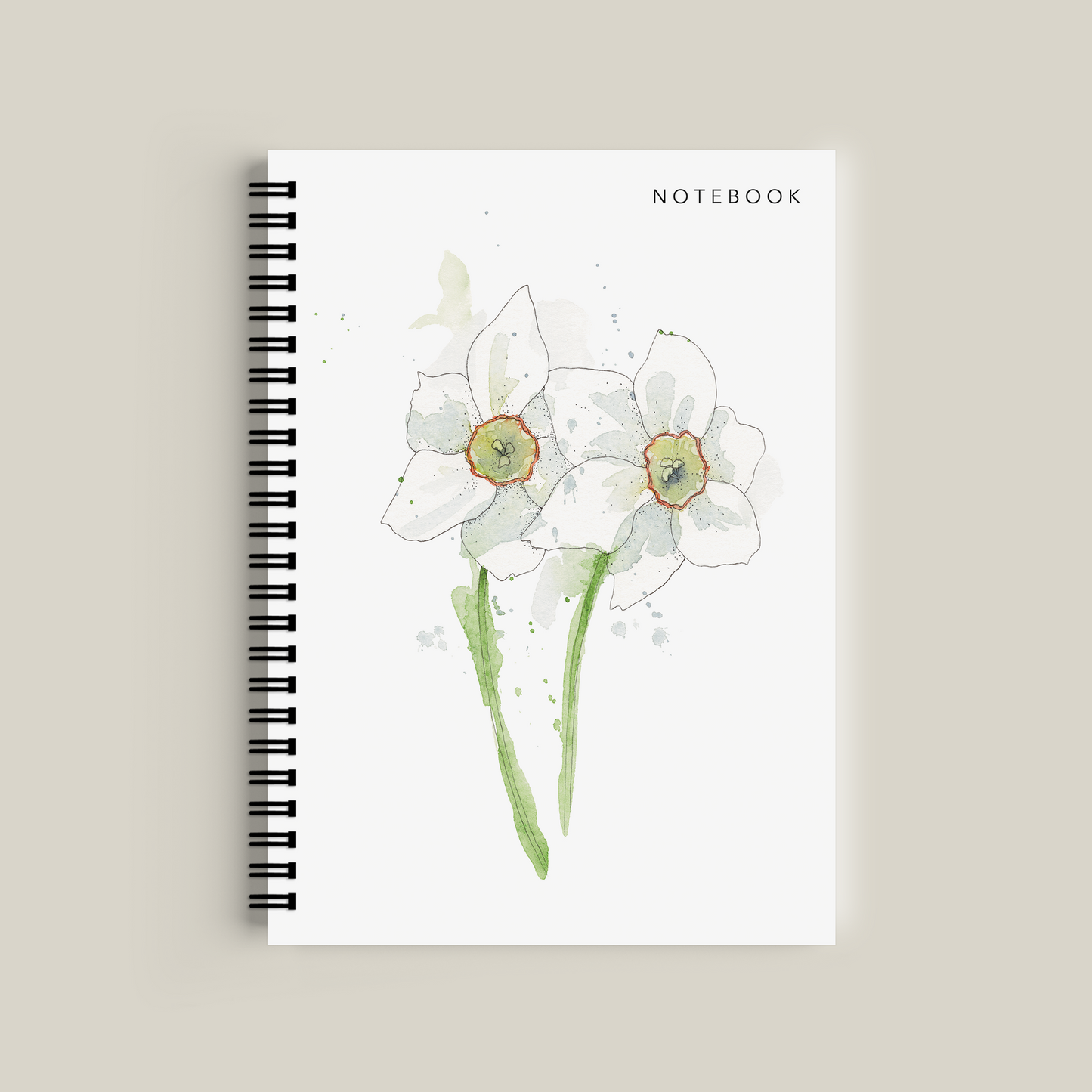 Notebook with floral design on a beige background