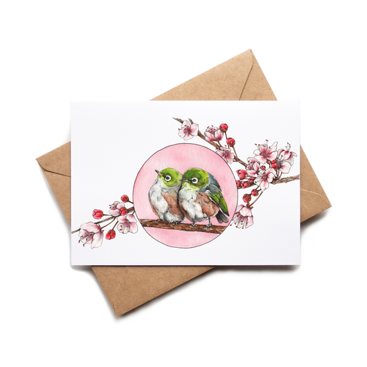 Card with two birds and a pink circle on a white background