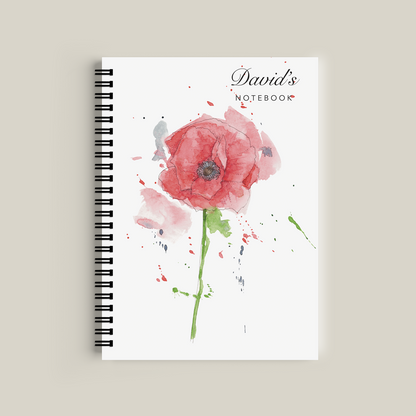 Notebook with a watercolor flower design on a beige background