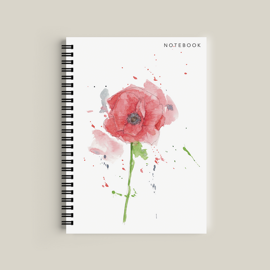Notebook with a pink flower design on a beige background