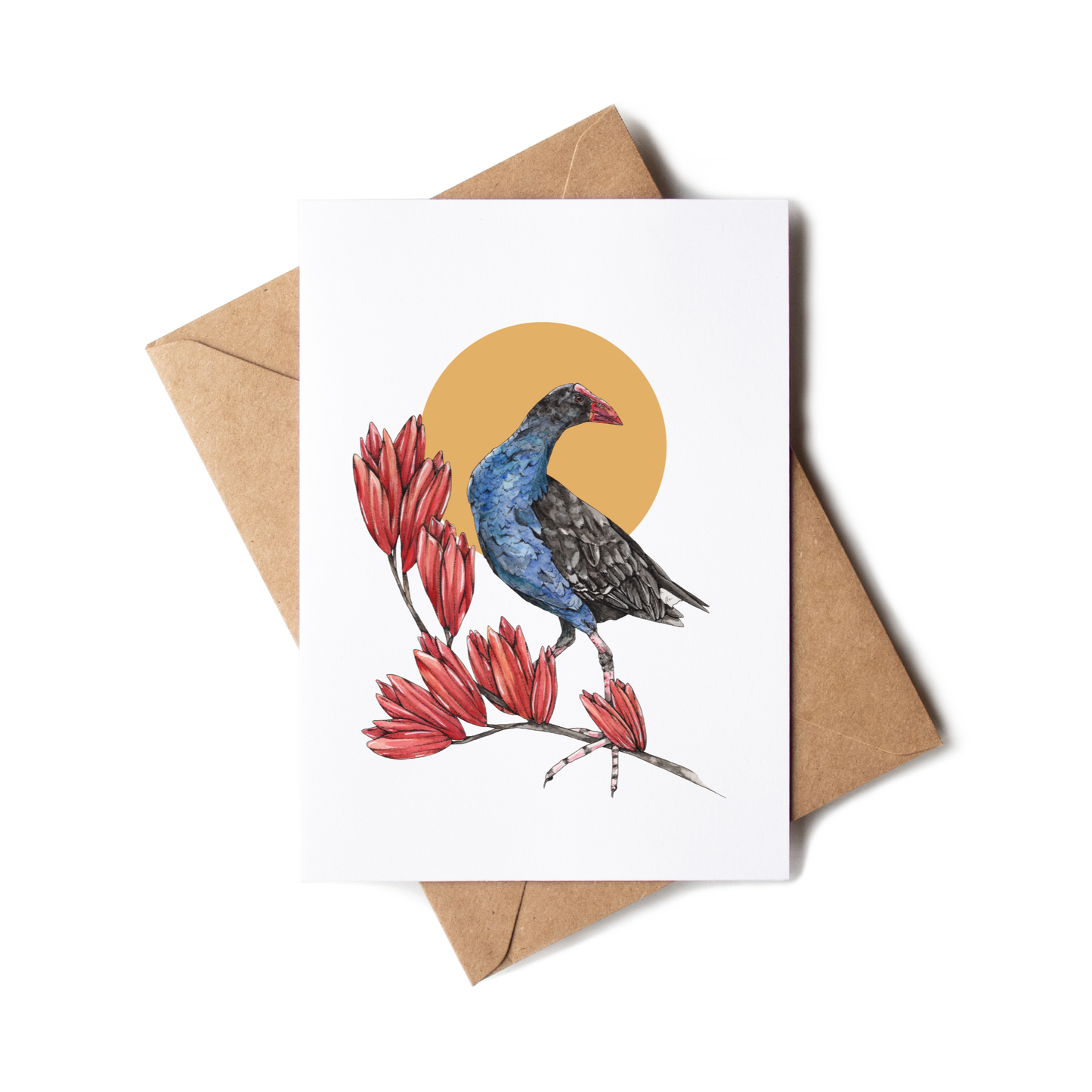 Greeting card with a bird and red flowers design on a white background with a brown envelope.