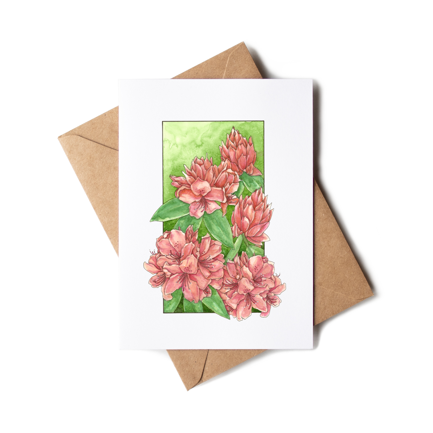 Greeting card with pink floral design on a white background with a brown envelope.