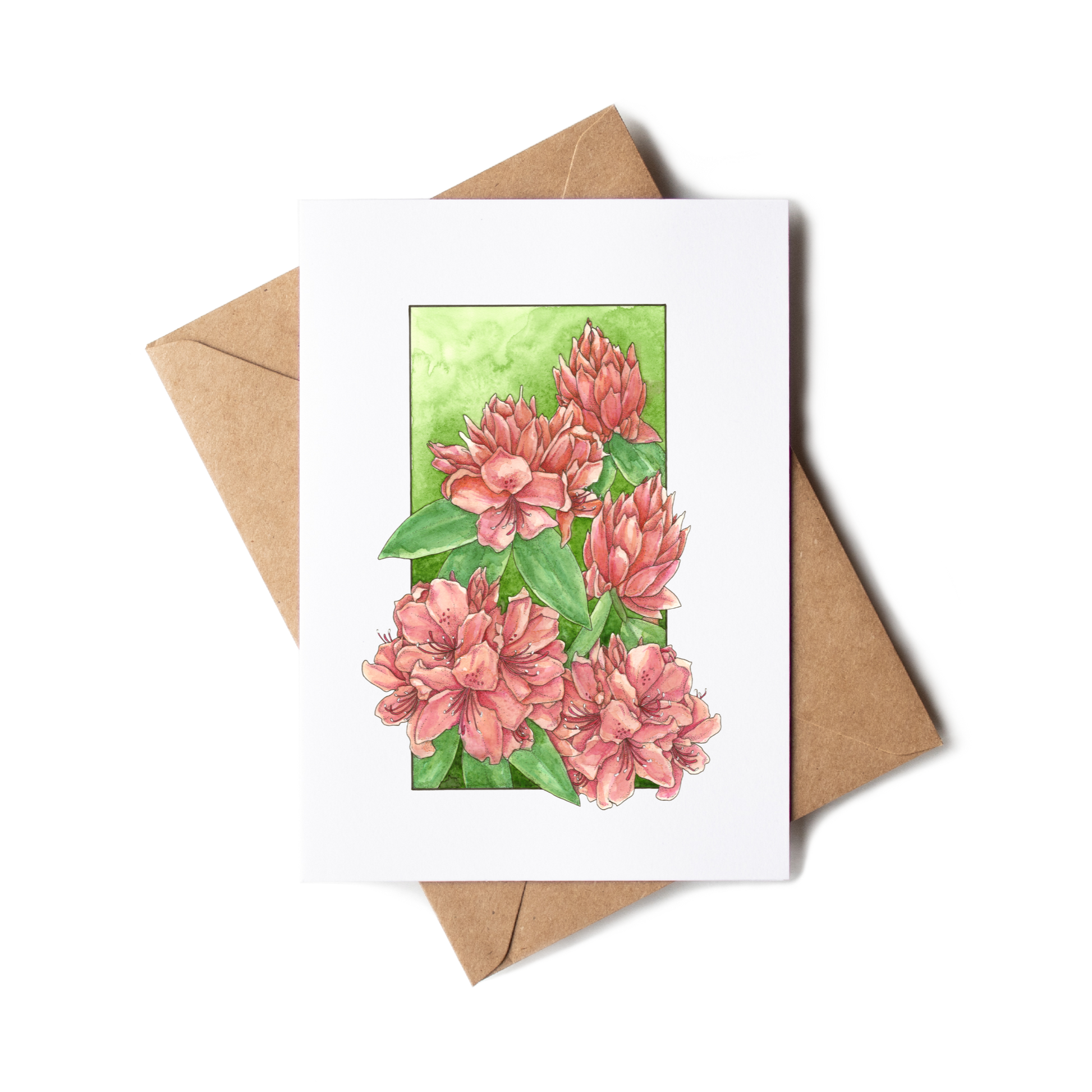 Greeting card with pink floral design on a white background with a brown envelope.