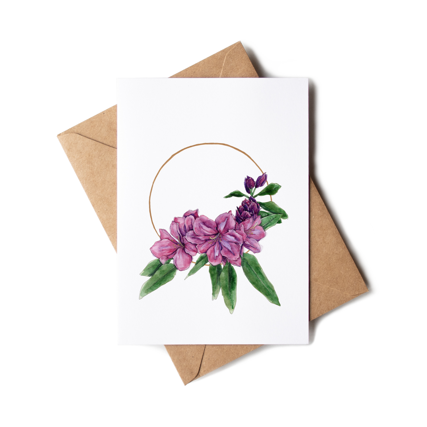 Greeting card with floral design and brown envelope on white background