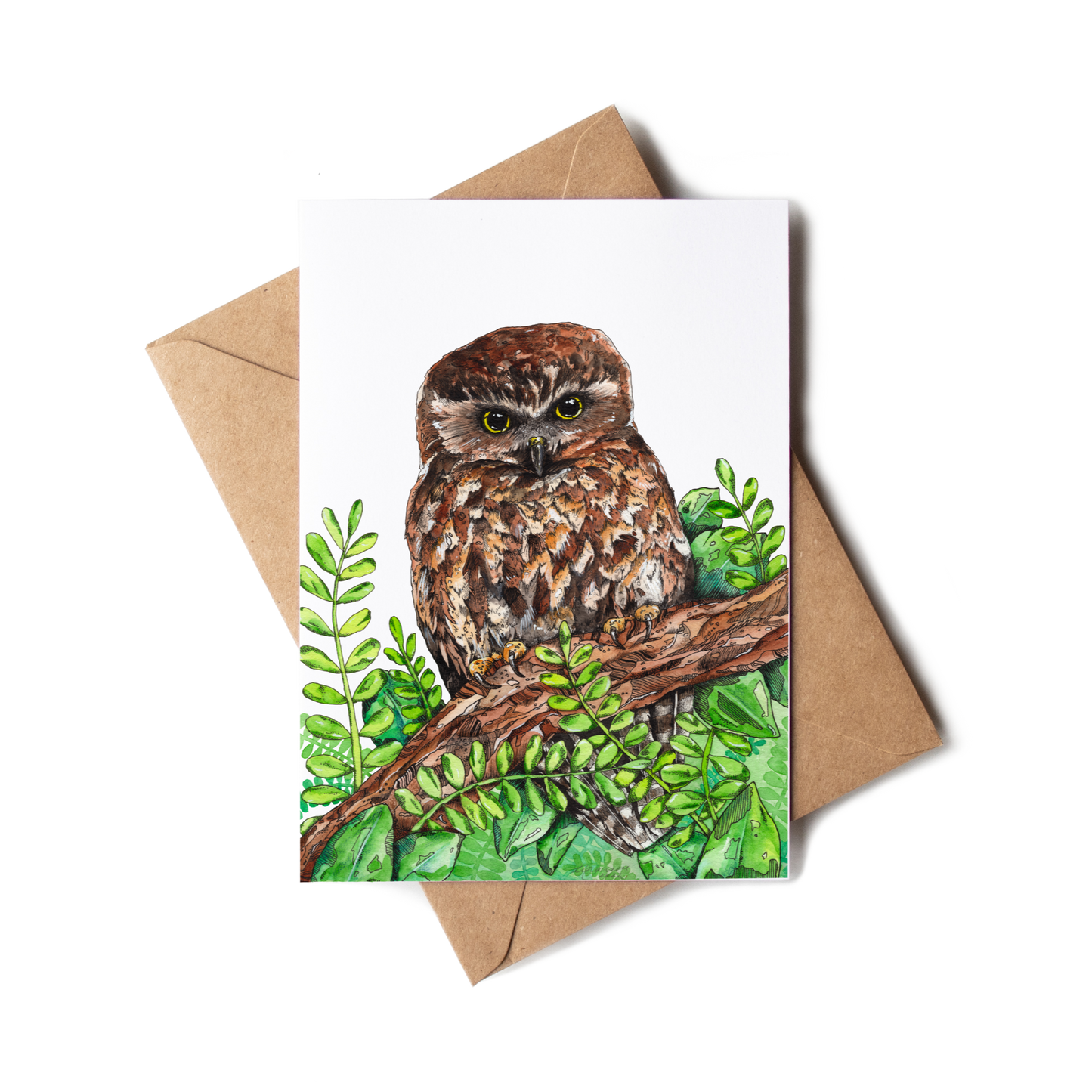 Greeting card with owl illustration on a branch and leaves, featuring a brown envelope.