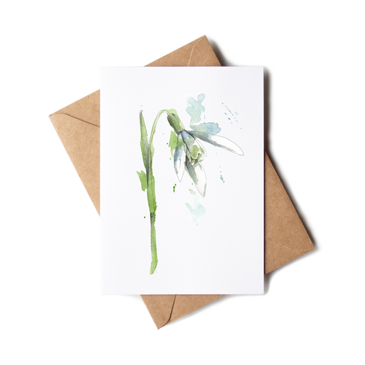 Greeting card with floral design and brown envelope on white background