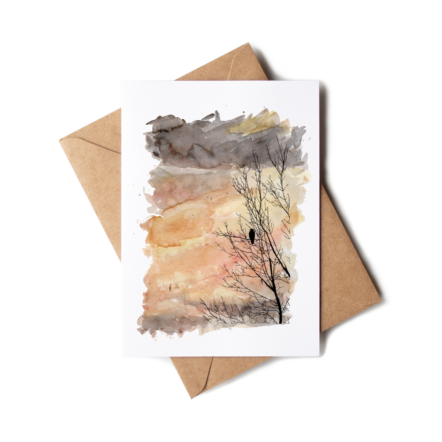 Greeting card with a tree silhouette and envelope on a white background