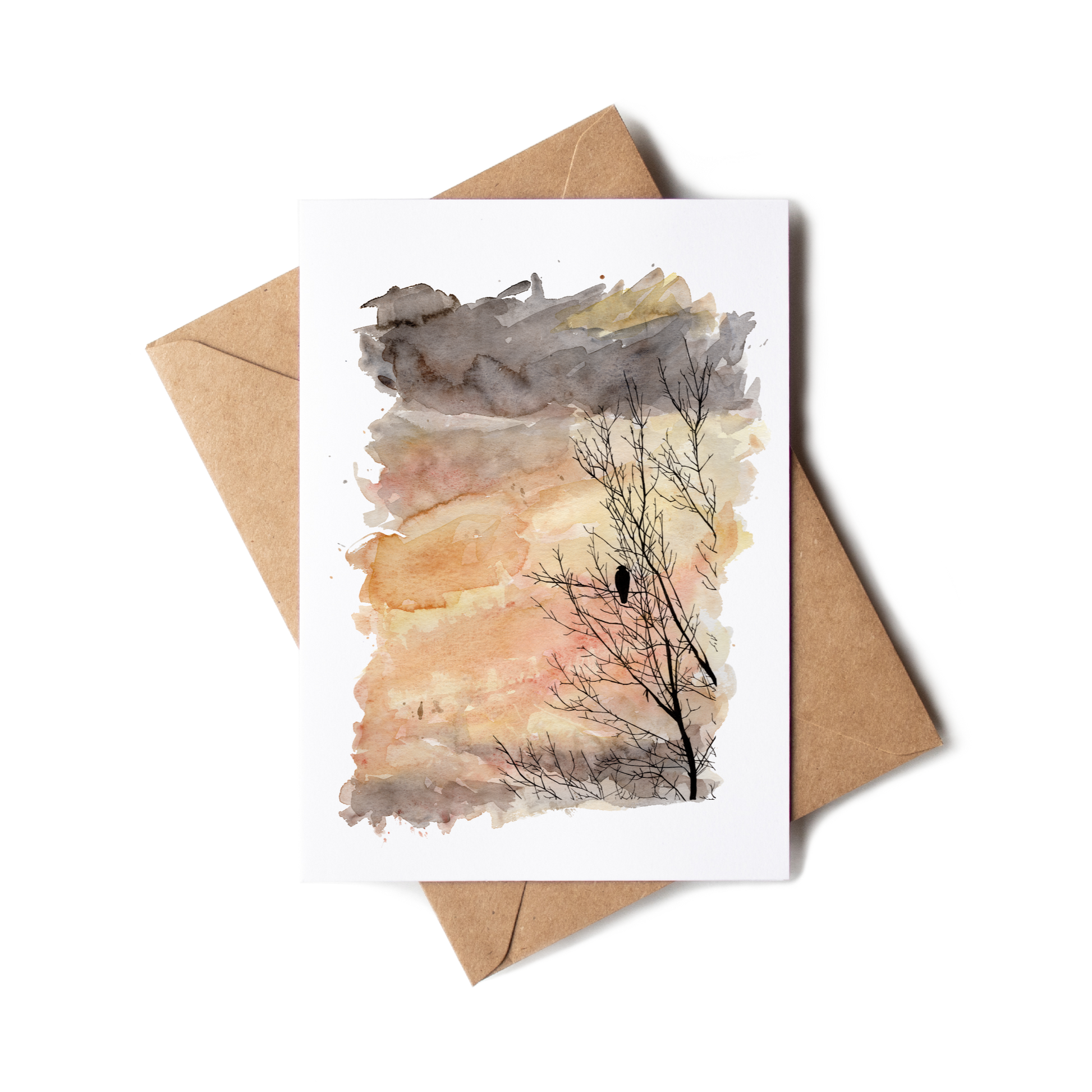 Greeting card with a tree silhouette and envelope on a white background