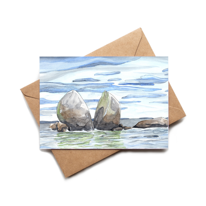 Greeting card with watercolor illustration of two rocks in the water, featuring a brown envelope.