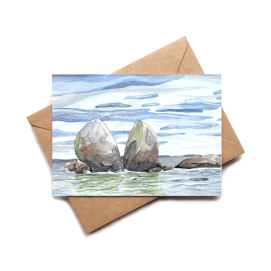 Greeting card with watercolor illustration of two rocks in the water, featuring a brown envelope.