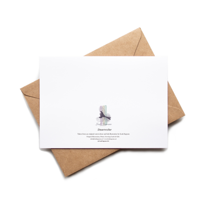 White card with a purple butterfly illustration on a brown envelope