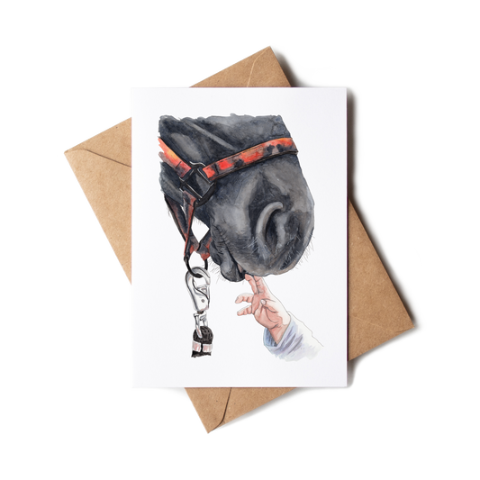 Greeting card with a horse's head and hand reaching through a bridle, on a white background.