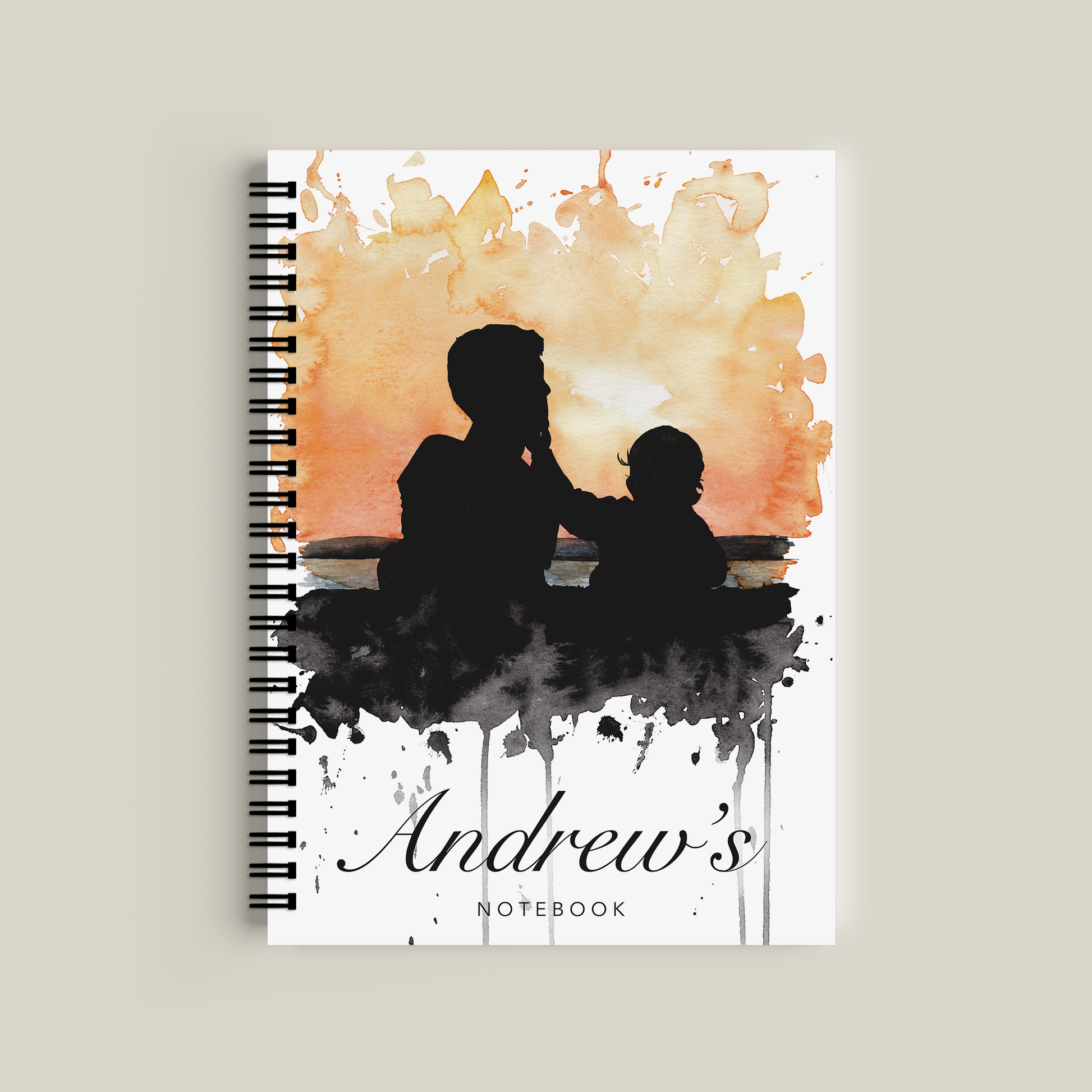 Notebook cover with silhouette of a man and child against an abstract watercolor background, personalized with 'Andrew's'.