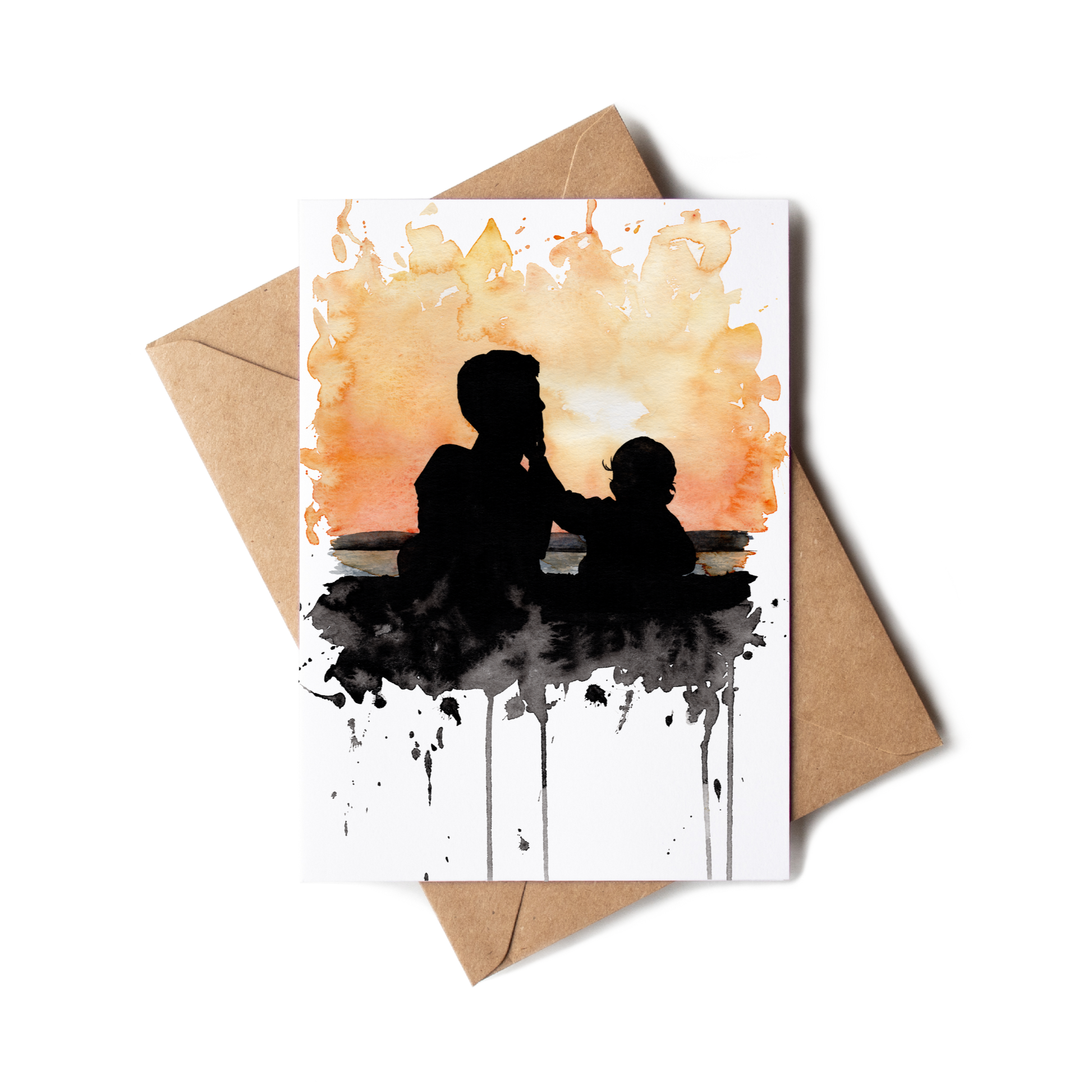 Greeting card with silhouette of a man and child against watercolor background, accompanied by a brown envelope.