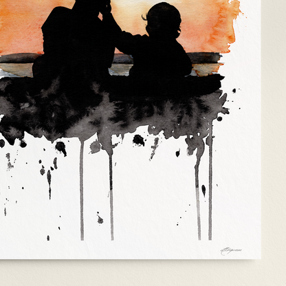 Art print of a silhouette of a father and child against an abstract watercolor background on a white wall.