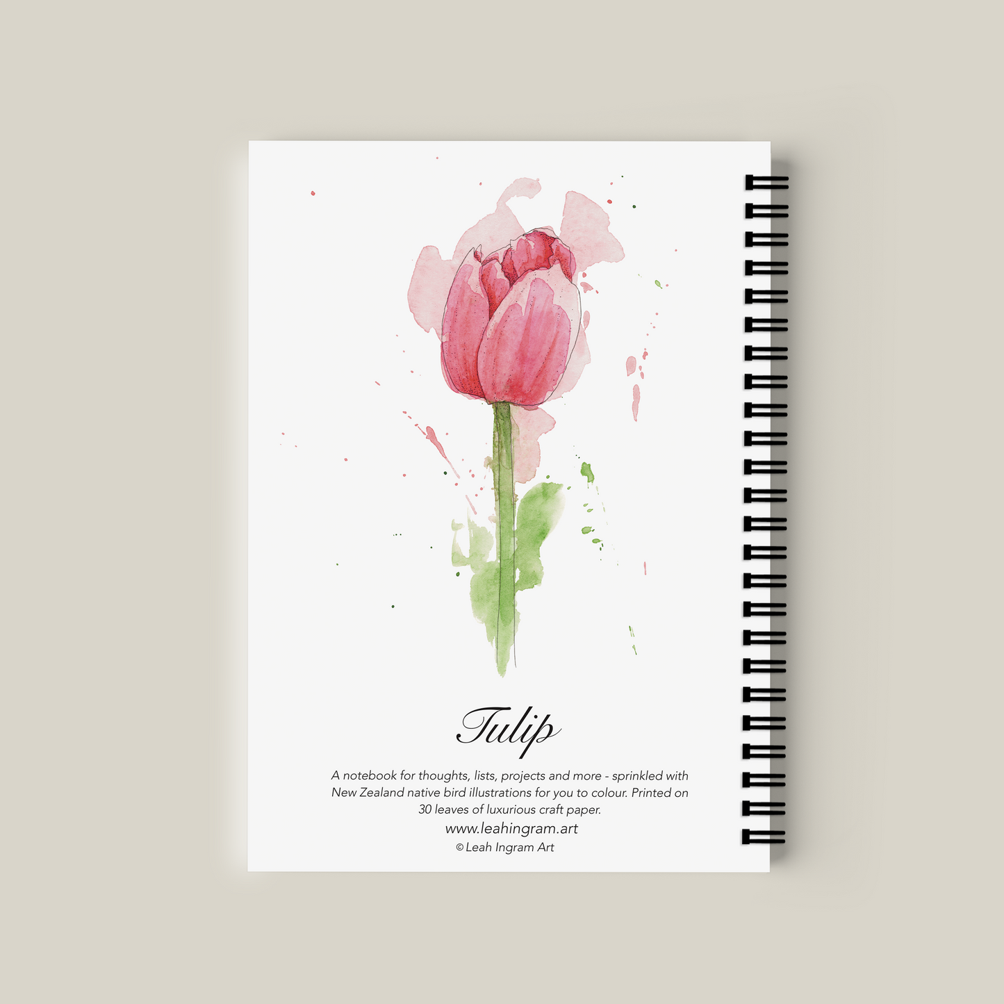 Notebook with pink tulip design on a beige background