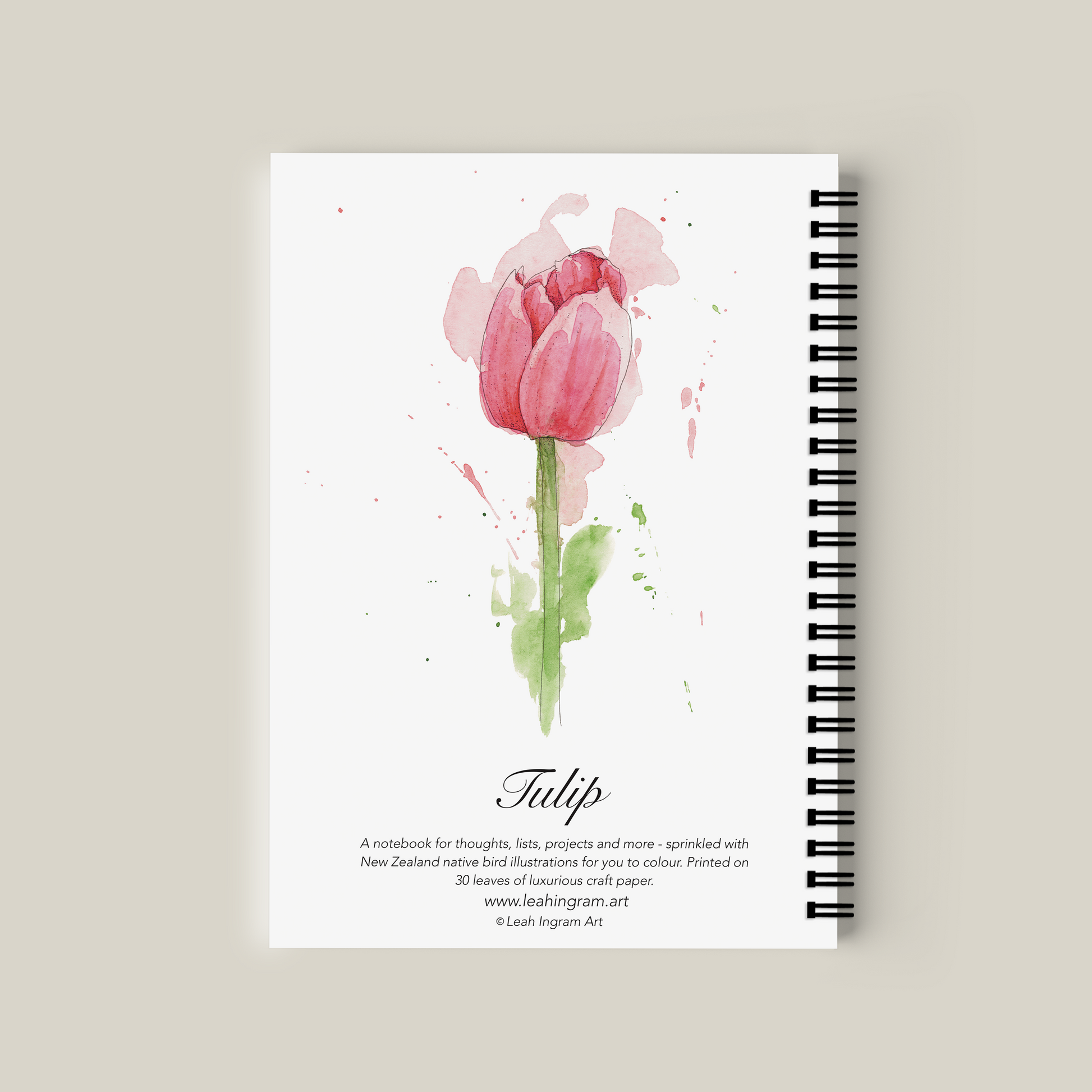 Notebook with pink tulip design on a beige background