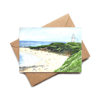 Greeting card with a beach and lighthouse illustration on a white background