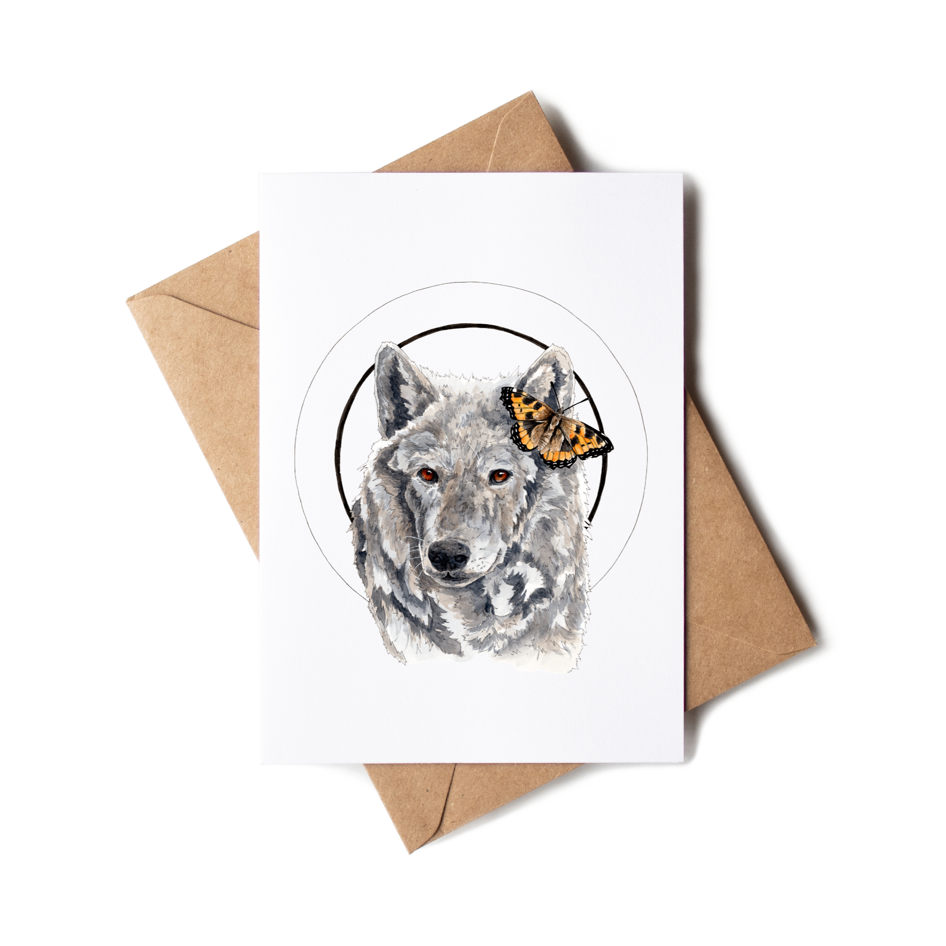 Greeting card with a wolf illustration on a white background with a brown envelope.
