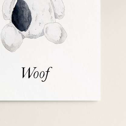 Stuffed dog toy with 'Woof' text on a white background