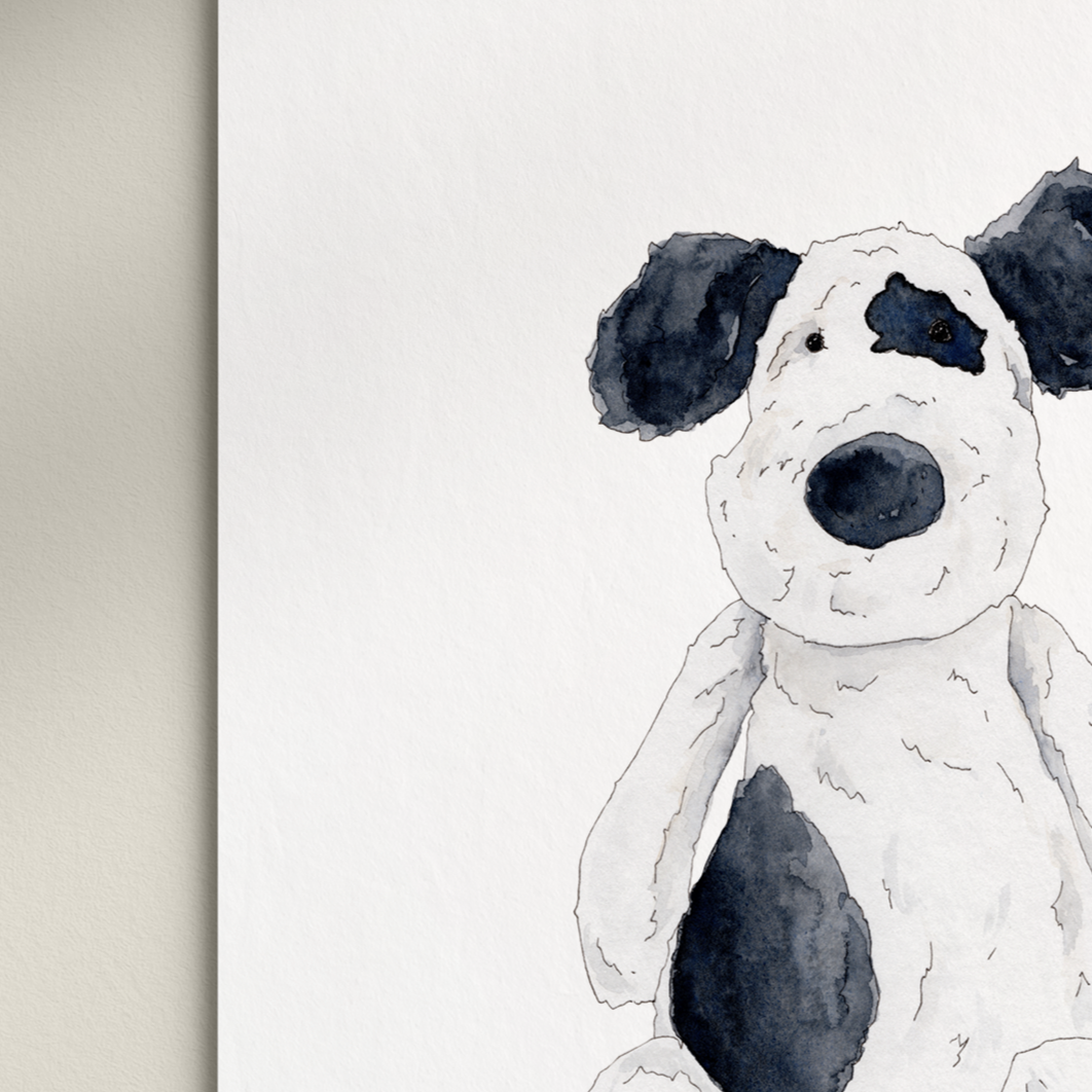 Stuffed dog toy with 'Woof' text on a white background