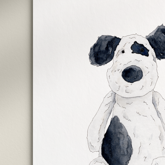 Stuffed dog toy with 'Woof' text on a white background